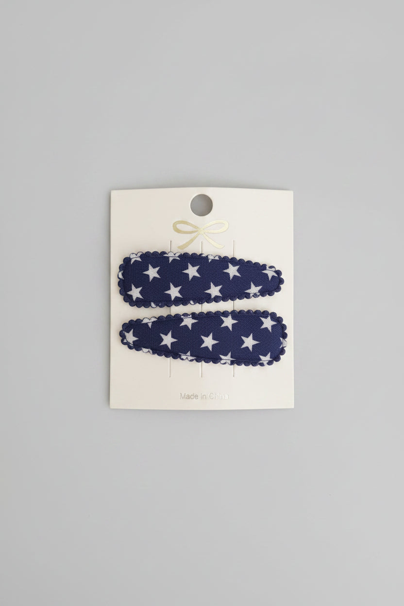 Kind klikspeld donkerblauw met witte sterren