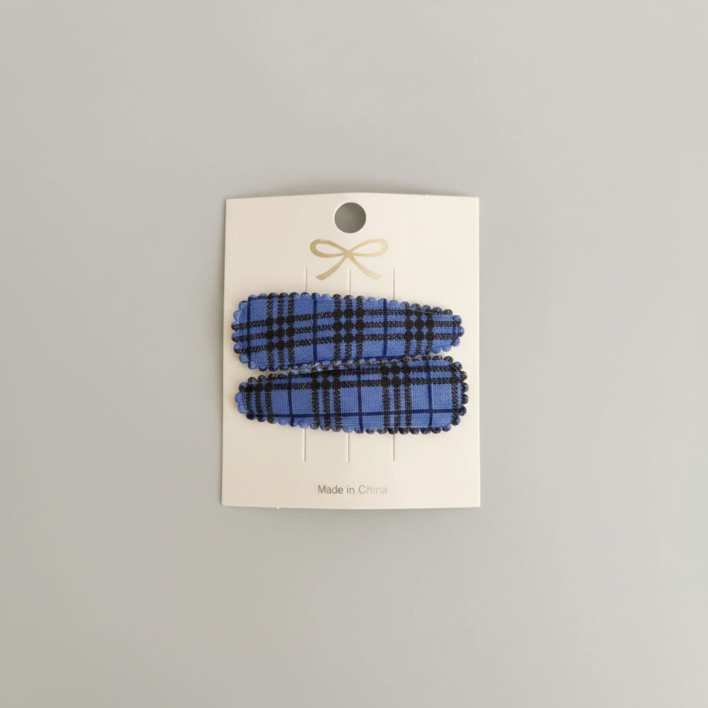 Kind klikspeld blauw schots patroon