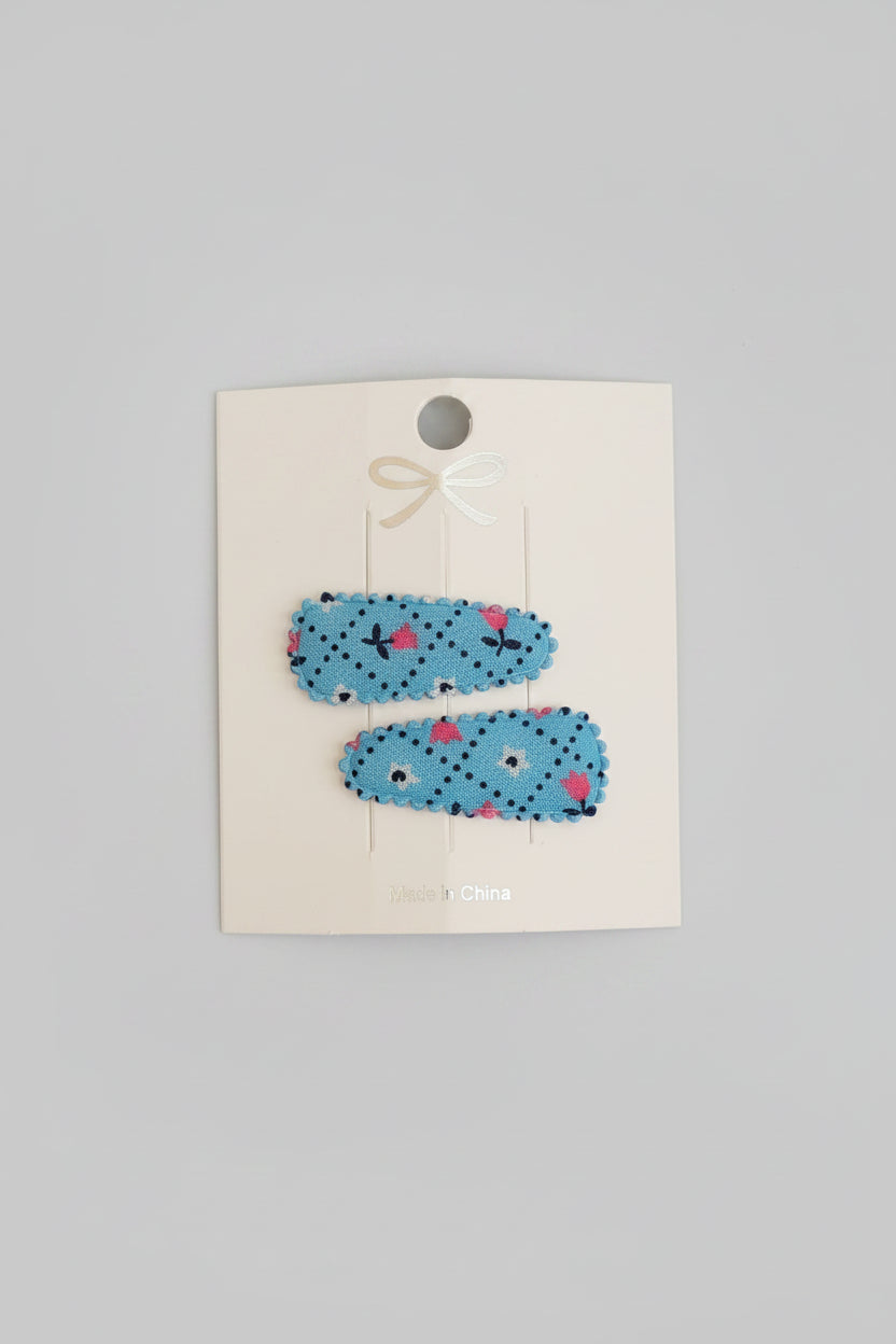 Baby klikspeld blauw met kleine bloemetjes
