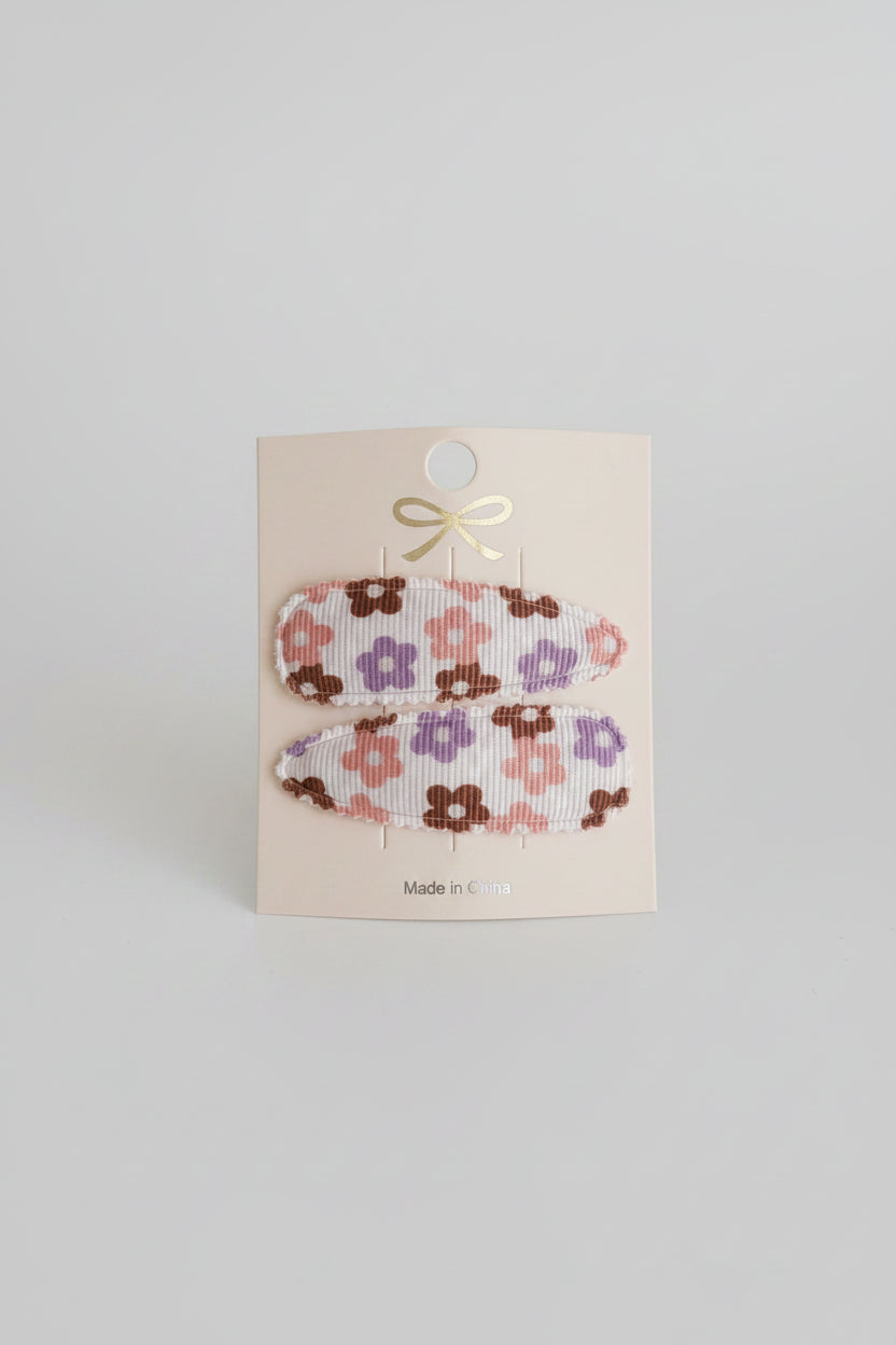 Kind klikspeld wit met bruin,paars, roze, blauwe bloemen