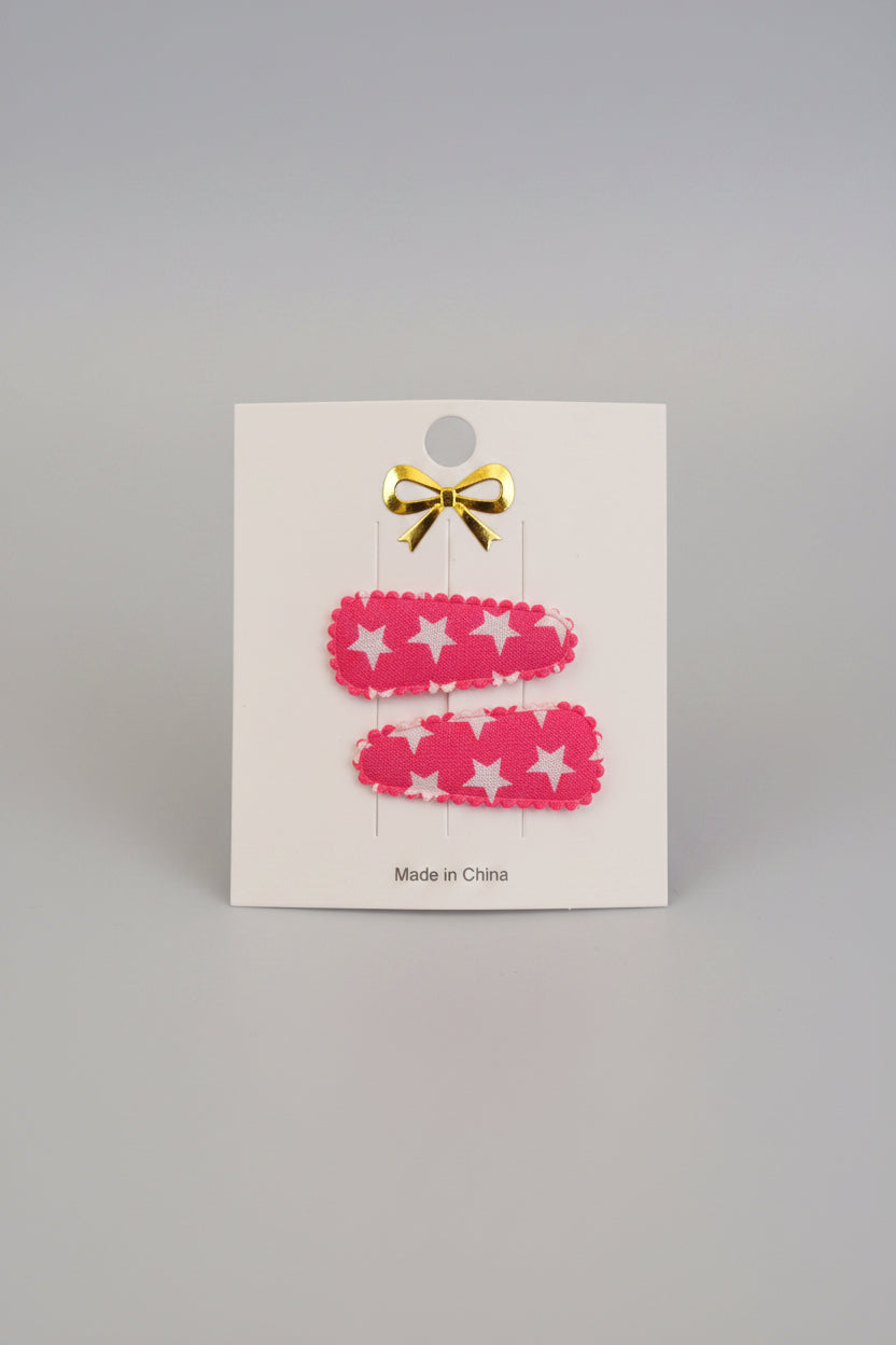 Baby klikspeld roze met witte sterren