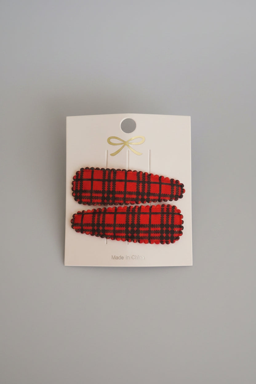 Kind klikspeld rood schots patroon