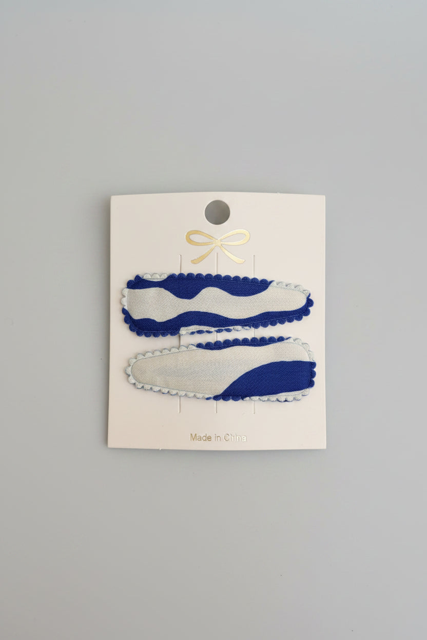 Kind klikspeld blauw en witte golven