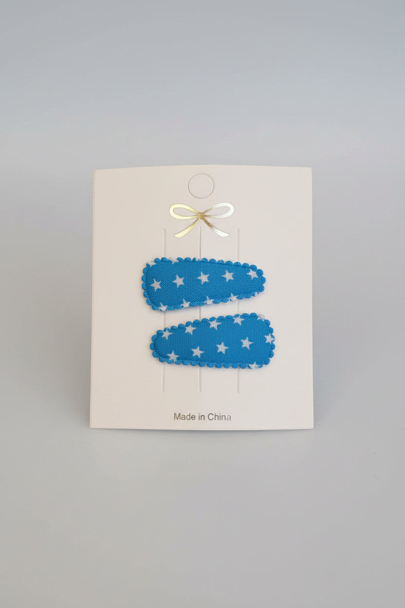 Baby klikspeld blauw met kleine witte sterretjes