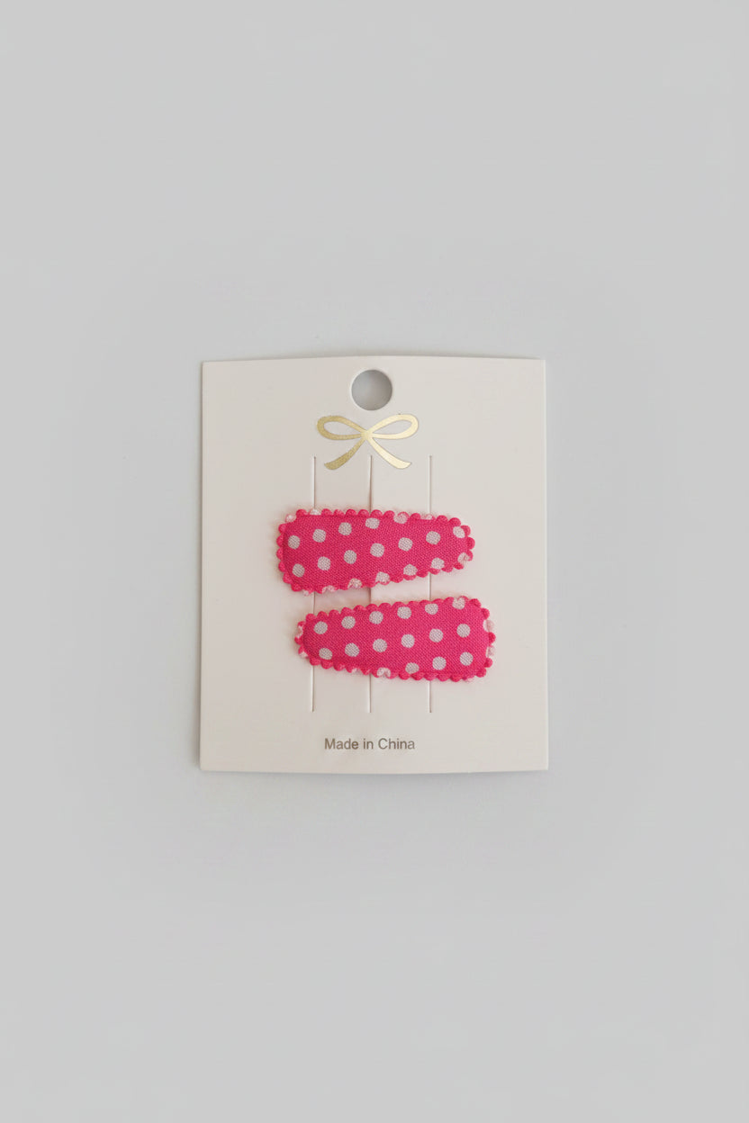 Baby klikspeld roze met witte stippen