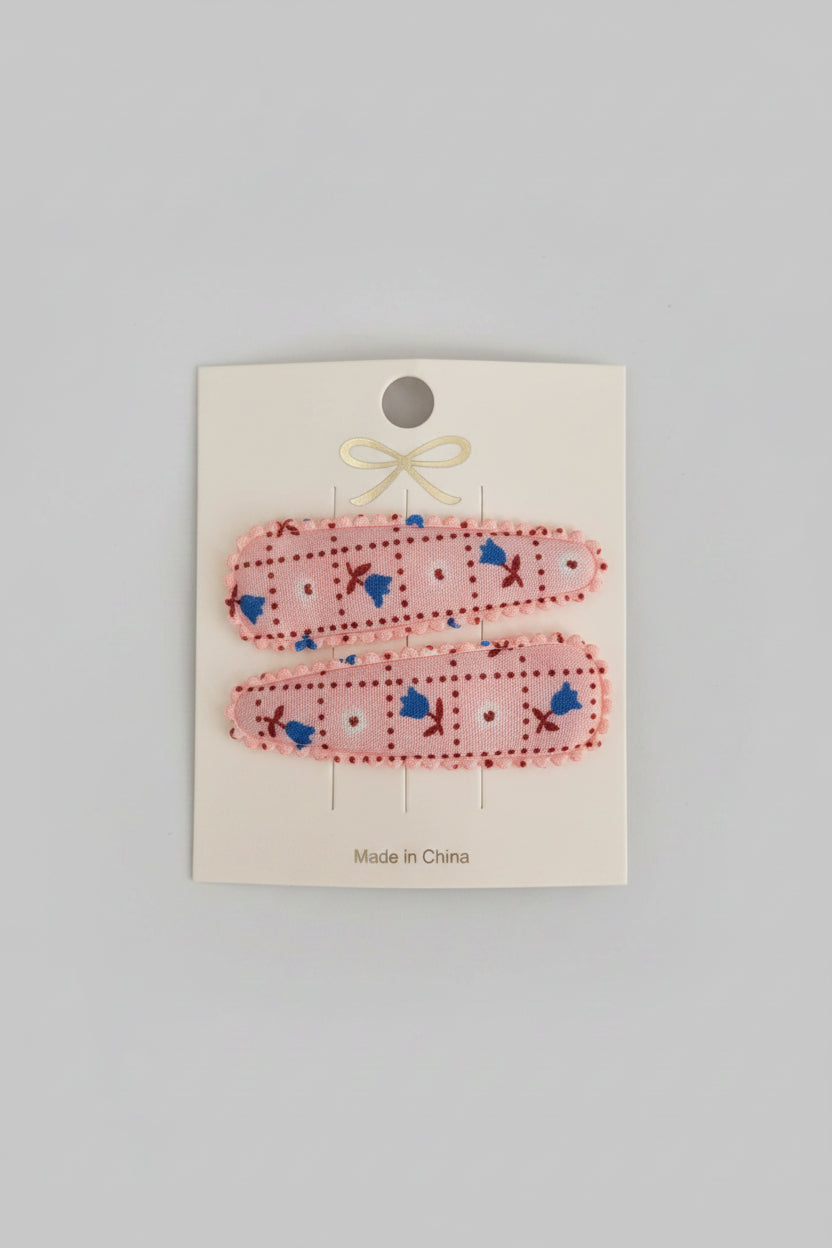 Kind klikspeld roze met kleine bloemetjes
