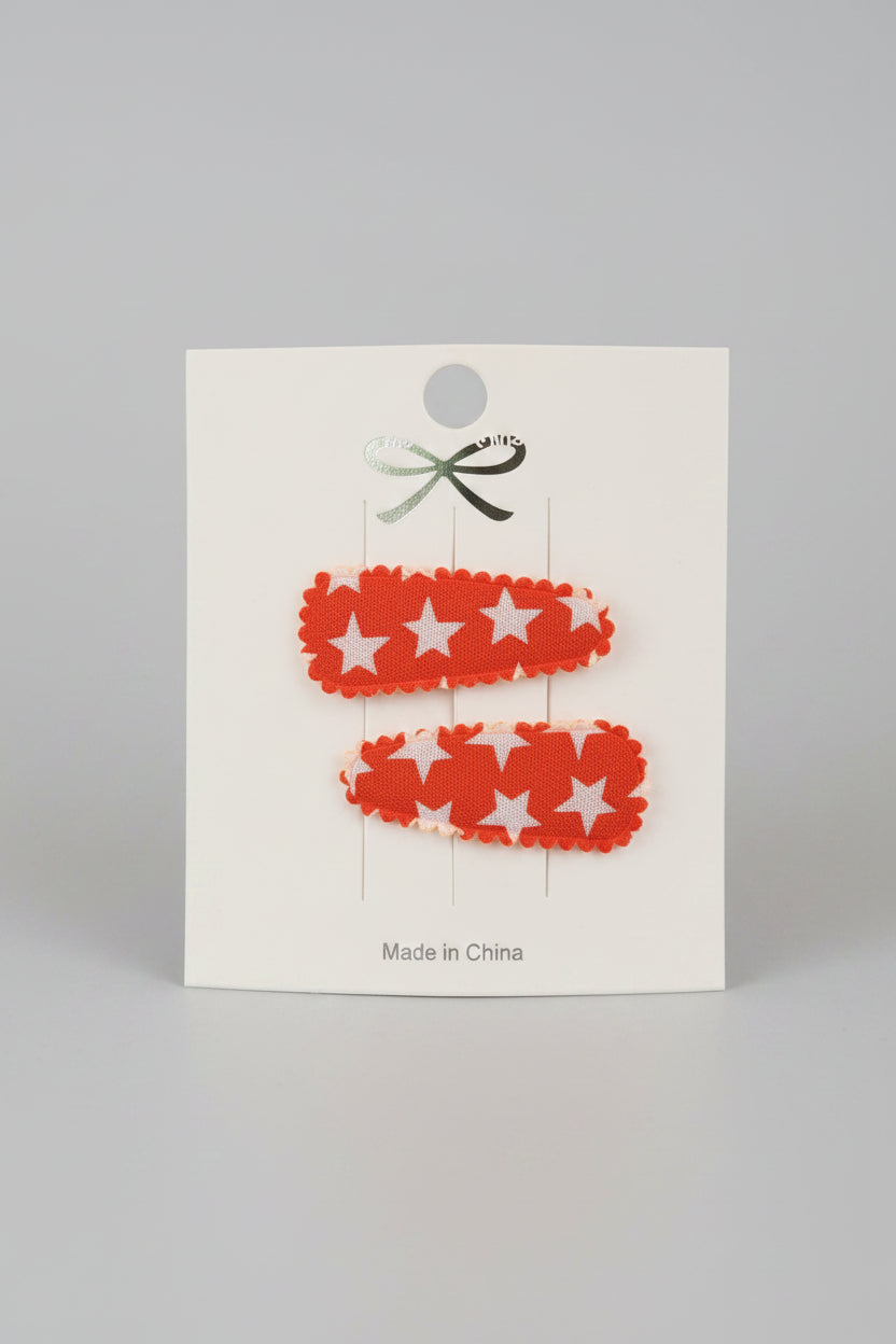 Baby klikspeld oranje met witte sterren