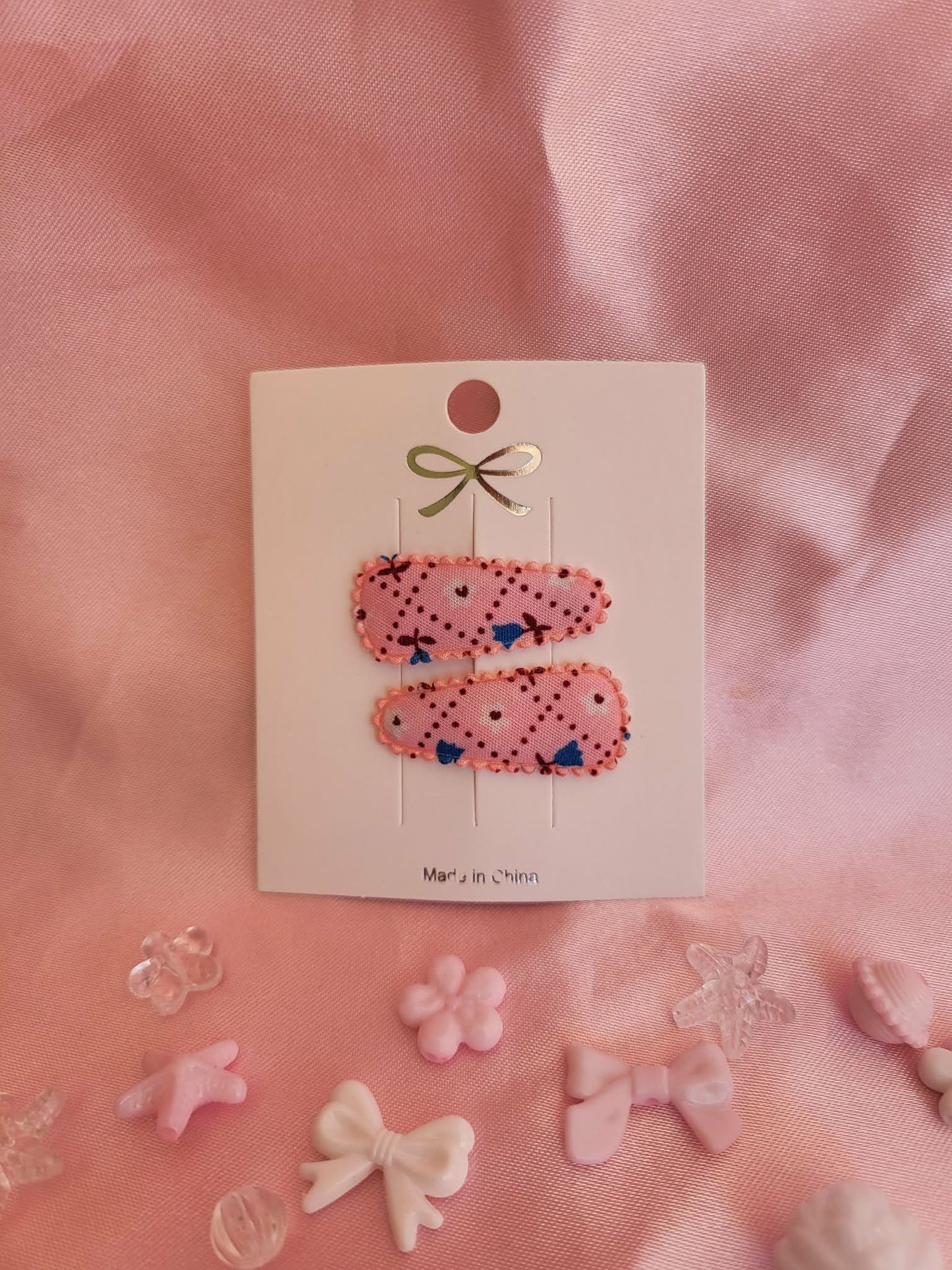 Baby klikspeld roze met kleine bloemetjes