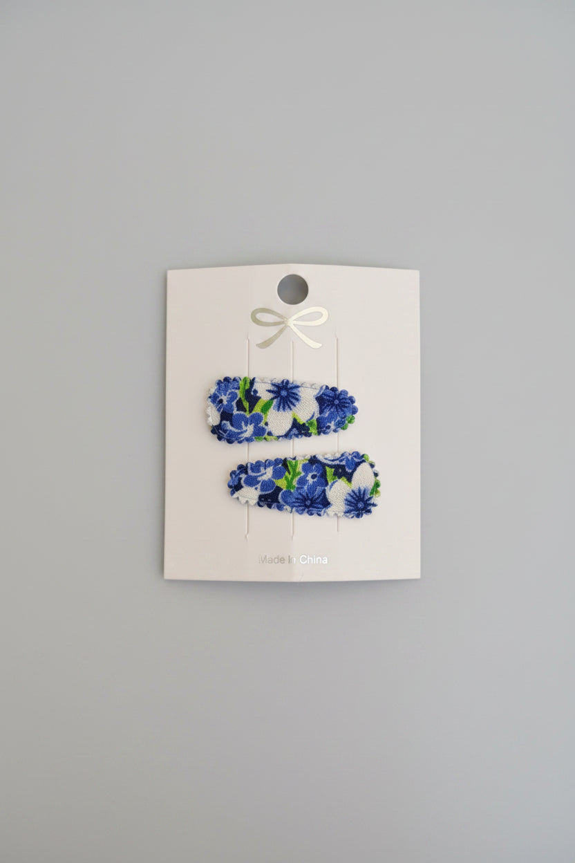 Baby klikspeld donkerblauwe bloemen