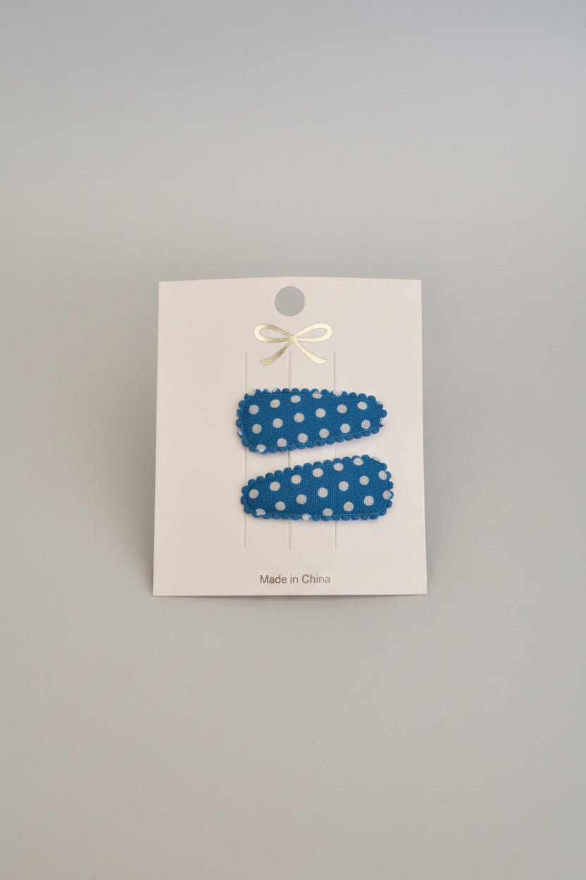 Baby klikspeld donkerblauw met witte stippen
