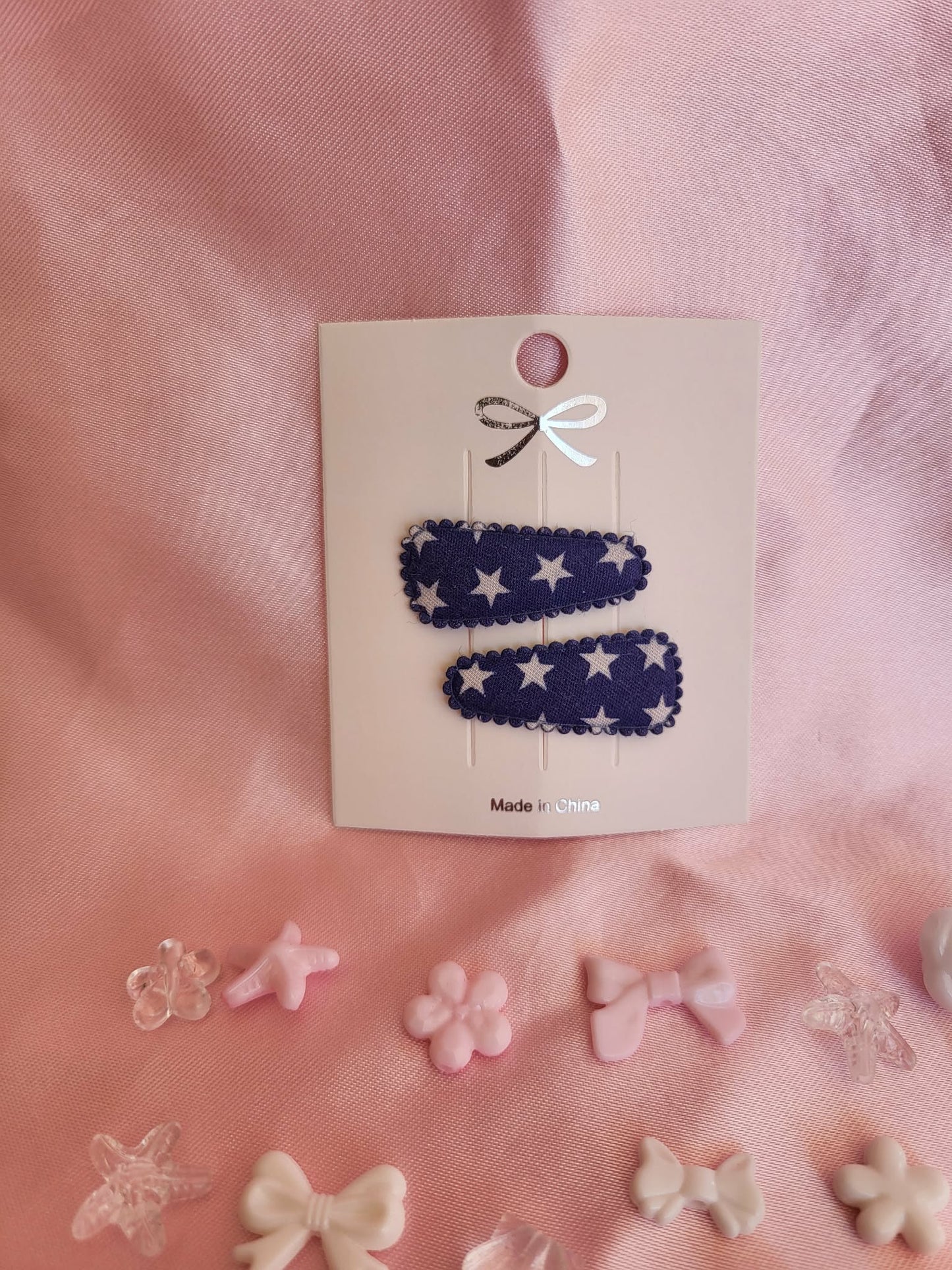Baby klikspeld donkerblauw met witte sterren