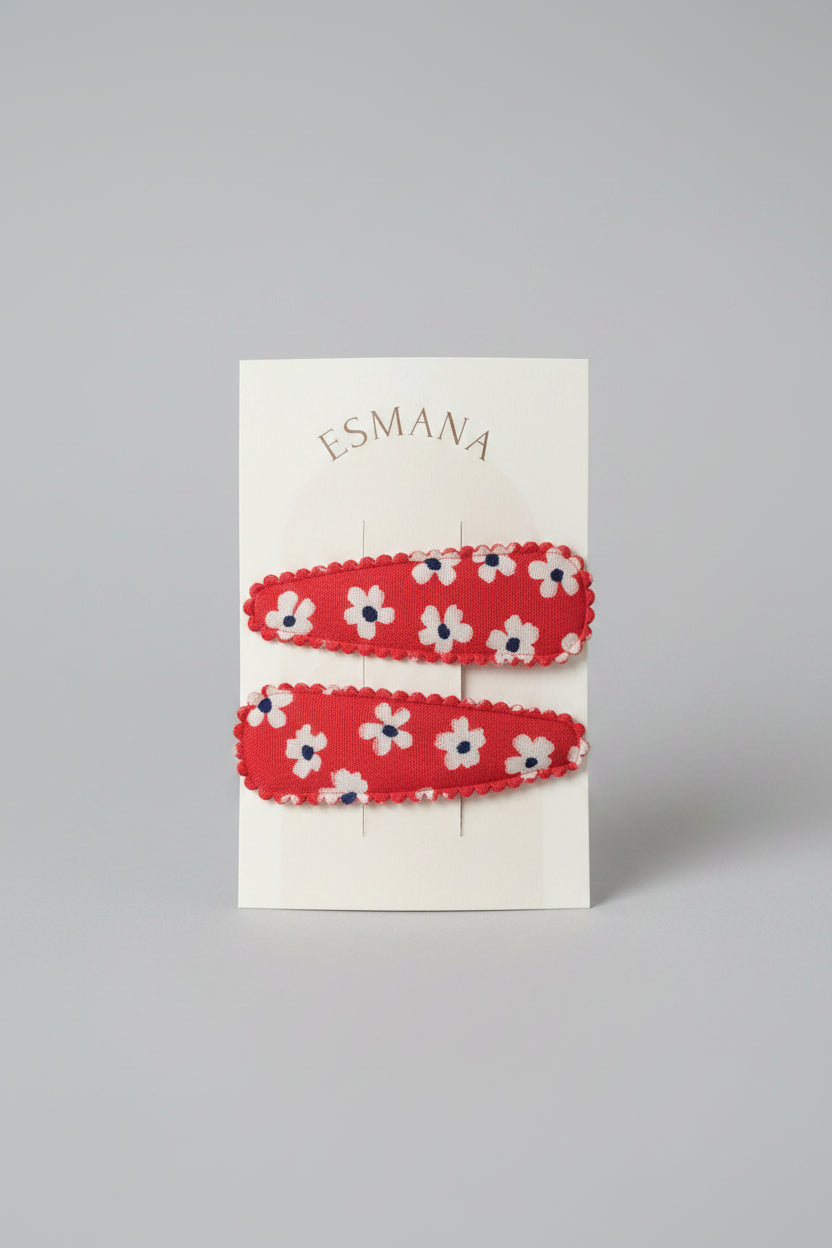 Kind klikspeld rood met witte bloemen