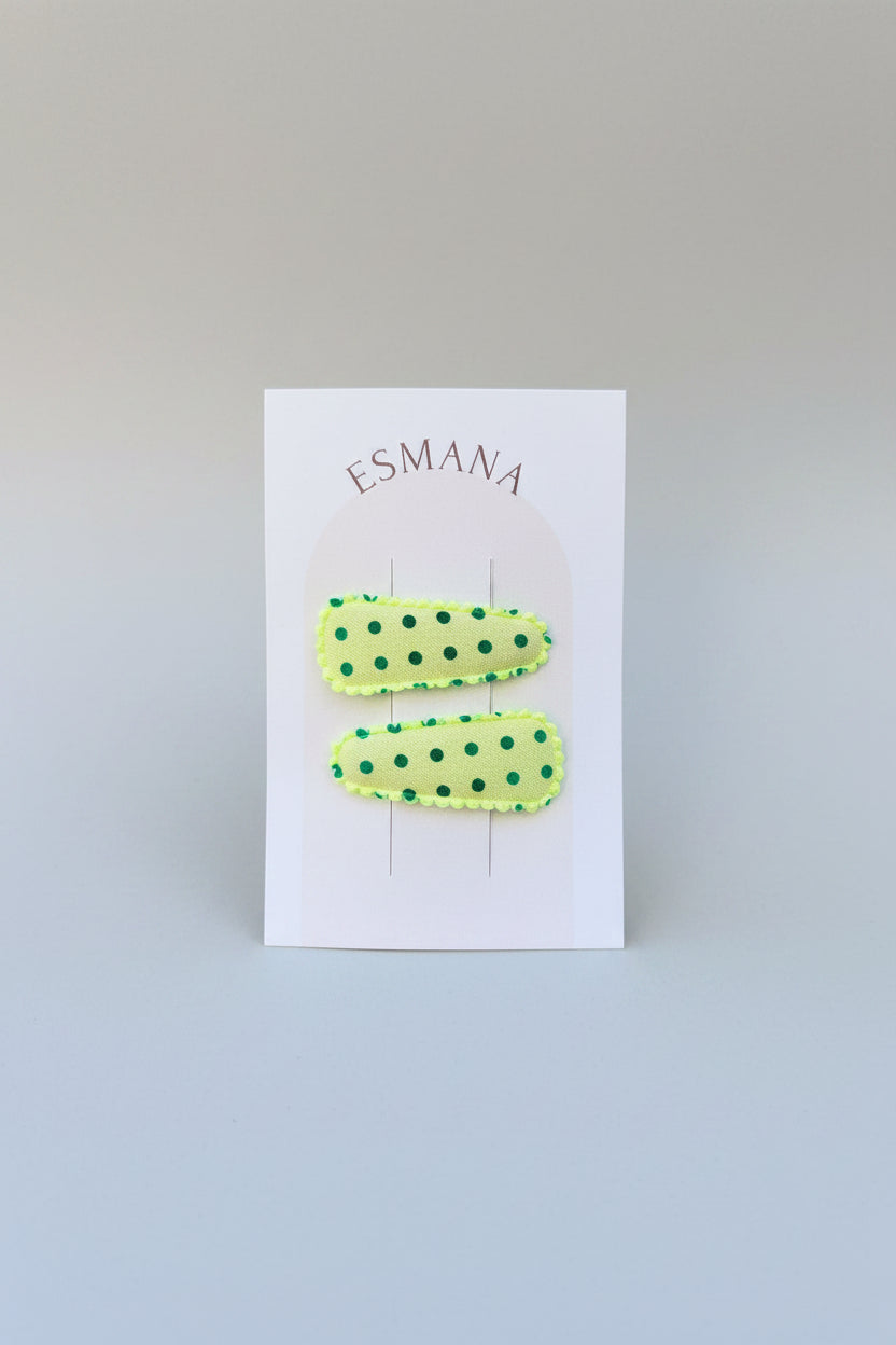 Baby klikspeld lichtgroen met groene stippen