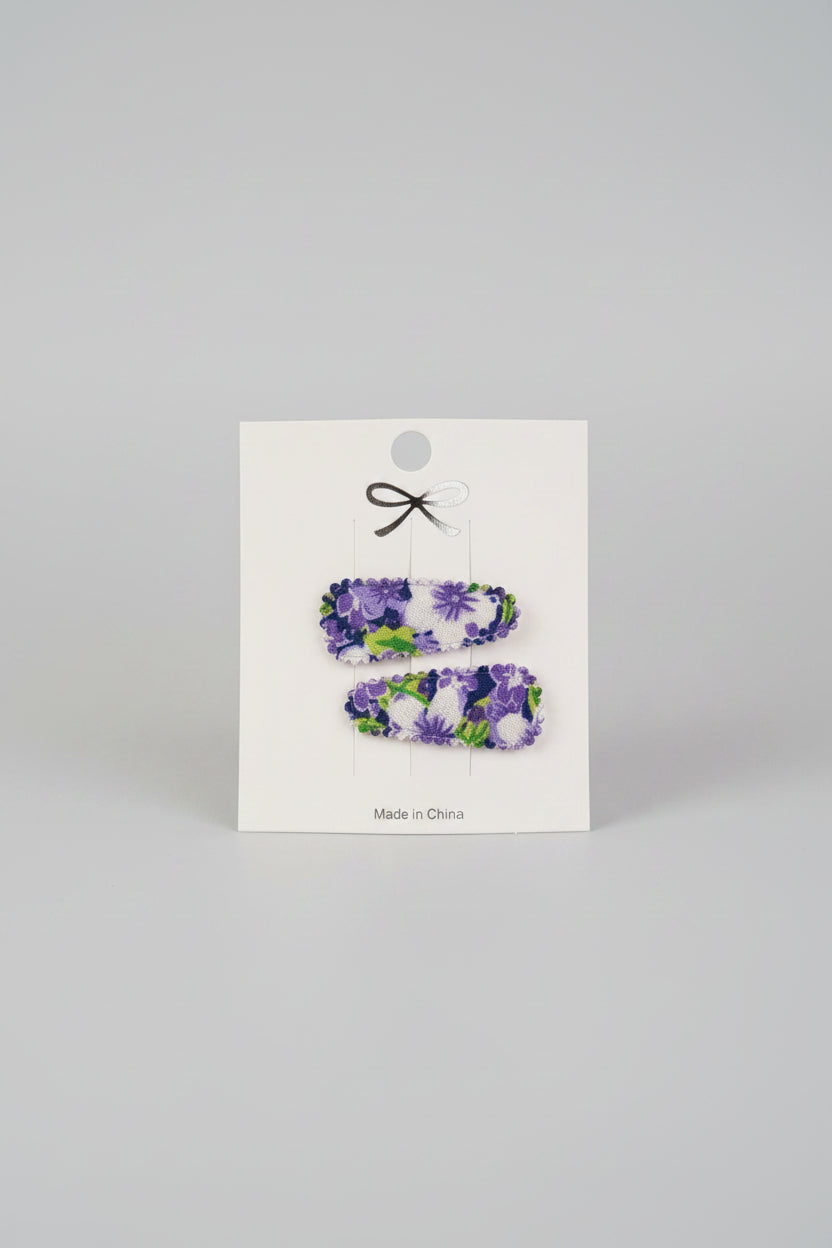 Baby klikspeld met paarse bloemen