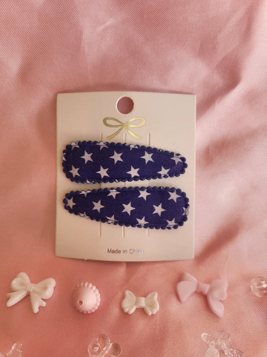 Kind klikspeld donkerblauw met witte sterren