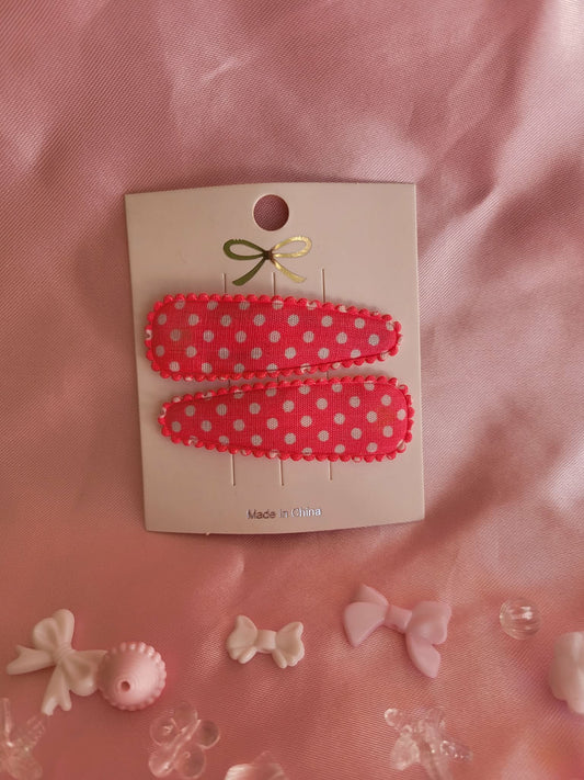 Kind klikspeld roze met witte stippen
