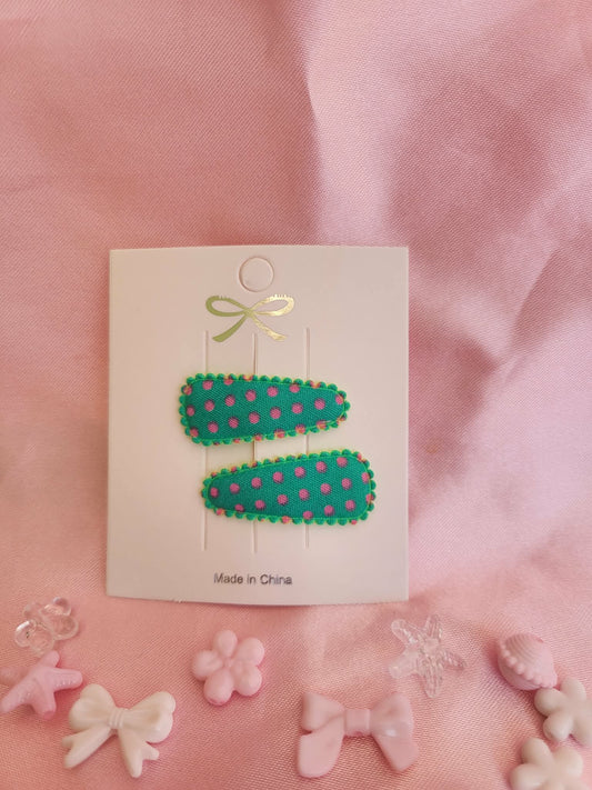 Baby klikspeld groen met roze stippen