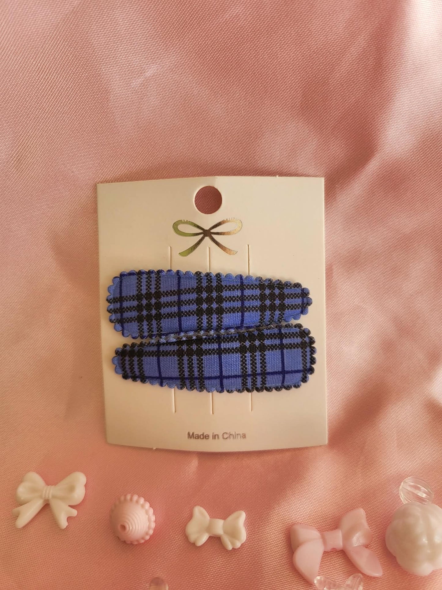 Kind klikspeld blauw schots patroon