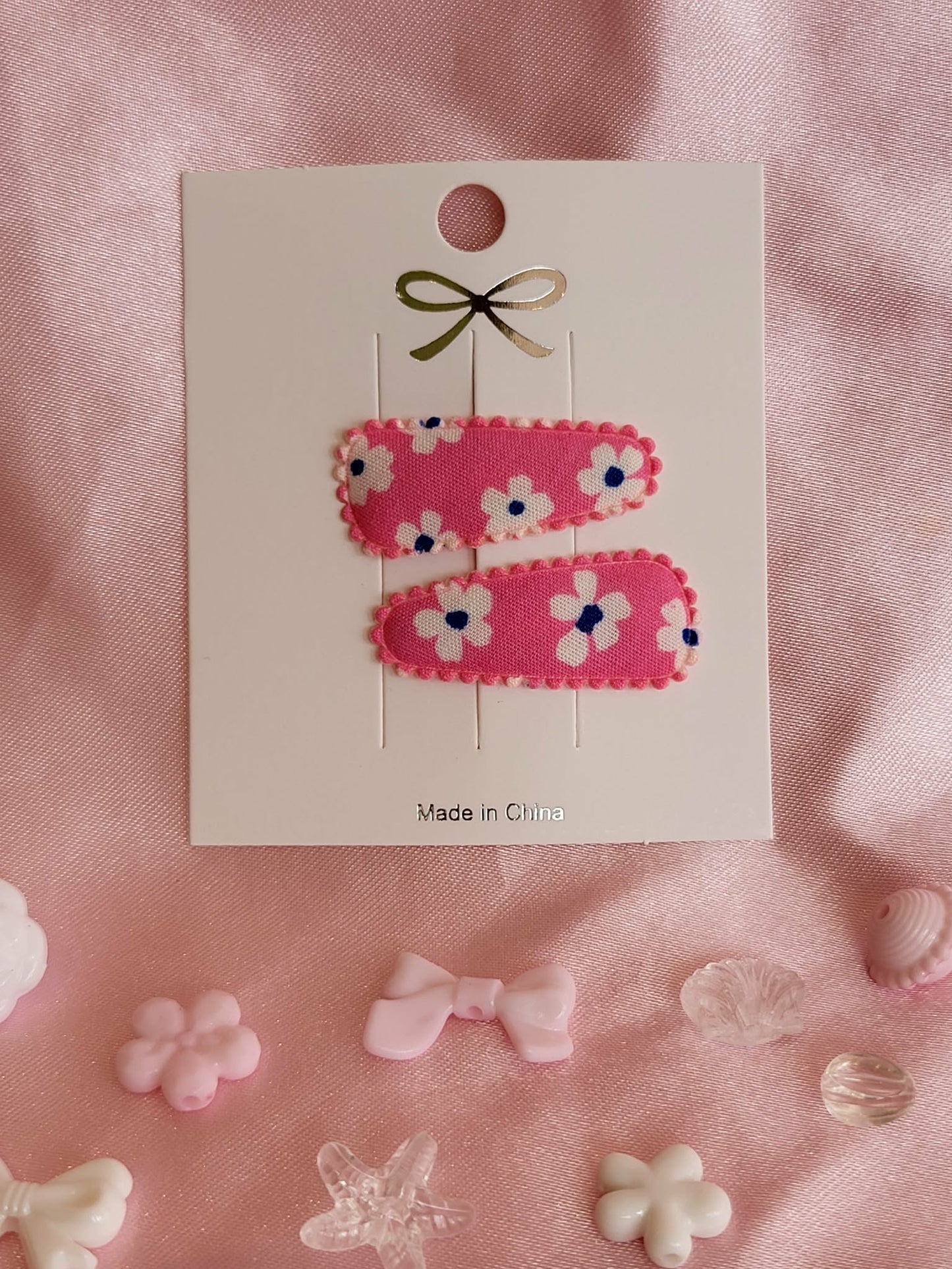 baby klikspeld roze met witte bloemen