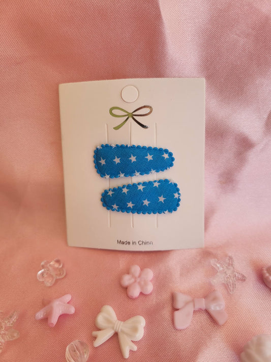 Baby klikspeld blauw met kleine witte sterretjes