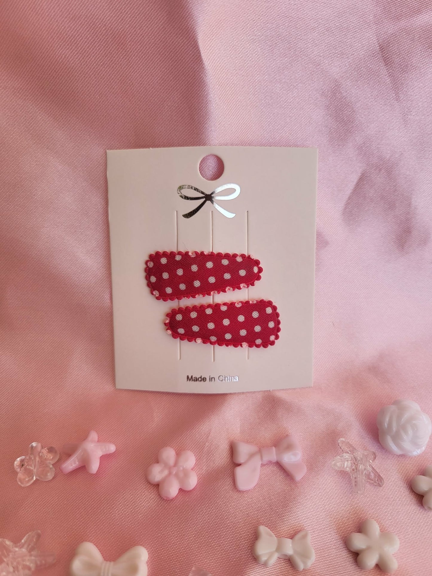Baby klikspeld rood met witte stippen