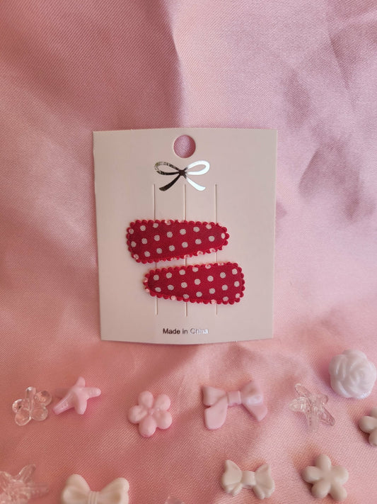 Baby klikspeld rood met witte stippen