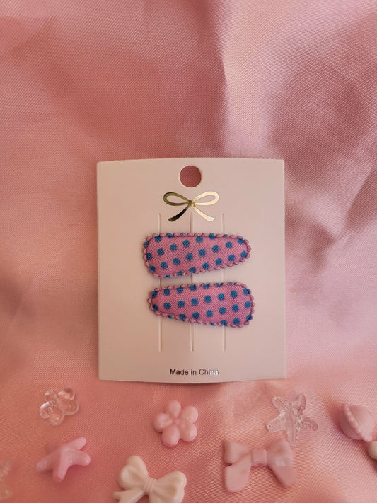 Baby klikspeld roze met blauwe stippen
