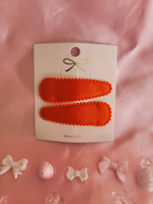 Kind klikspeld satijn oranje