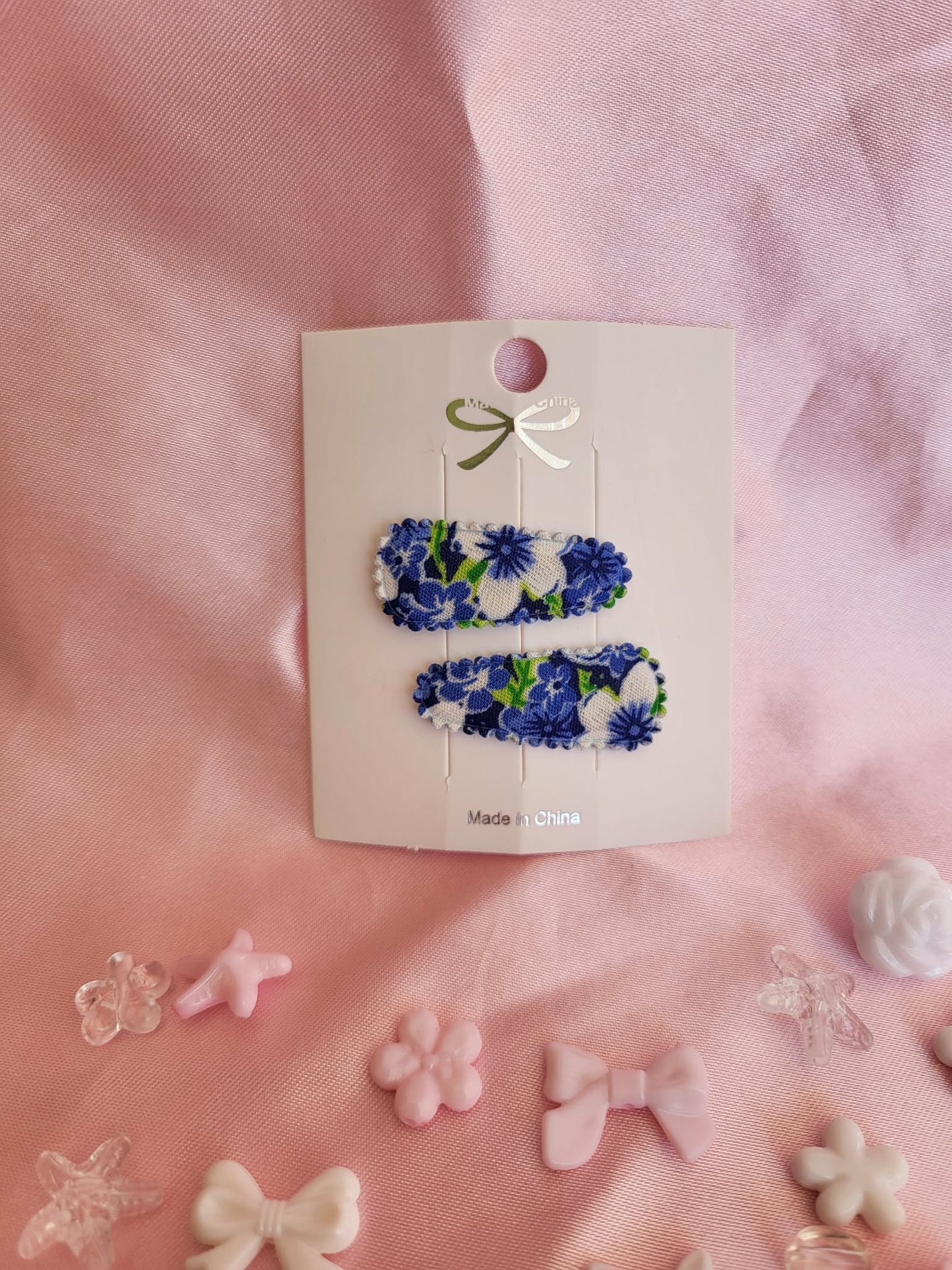 Baby klikspeld donkerblauwe bloemen