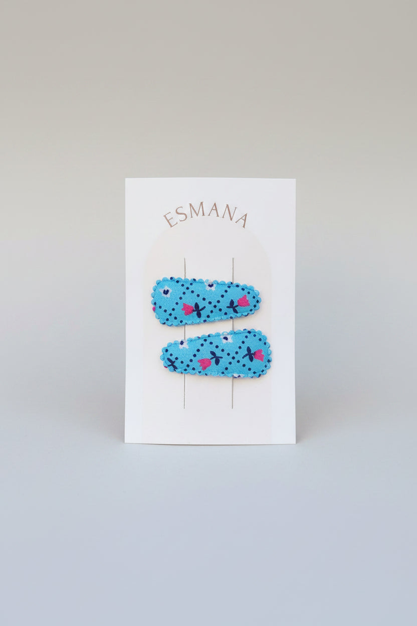 Baby klikspeld blauw met kleine bloemetjes