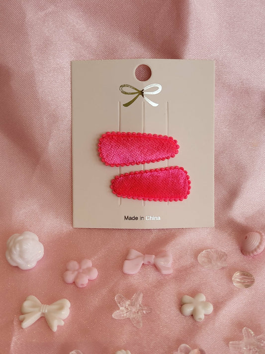 Baby klikspeld fluweel neonroze