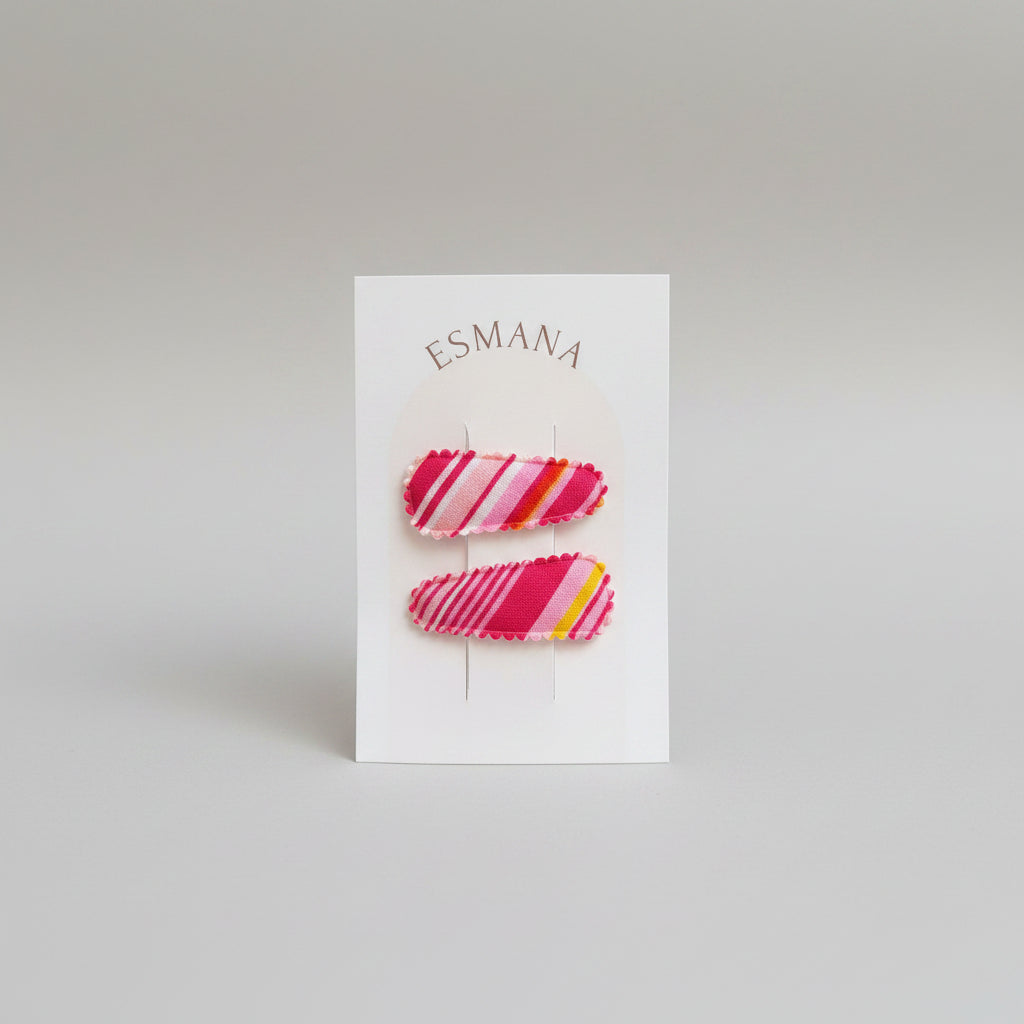 Baby klikspeld gestreepte roze tinten