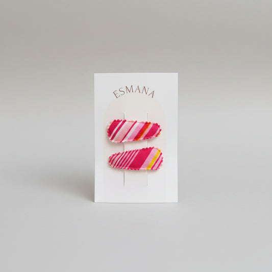 Baby klikspeld gestreepte roze tinten