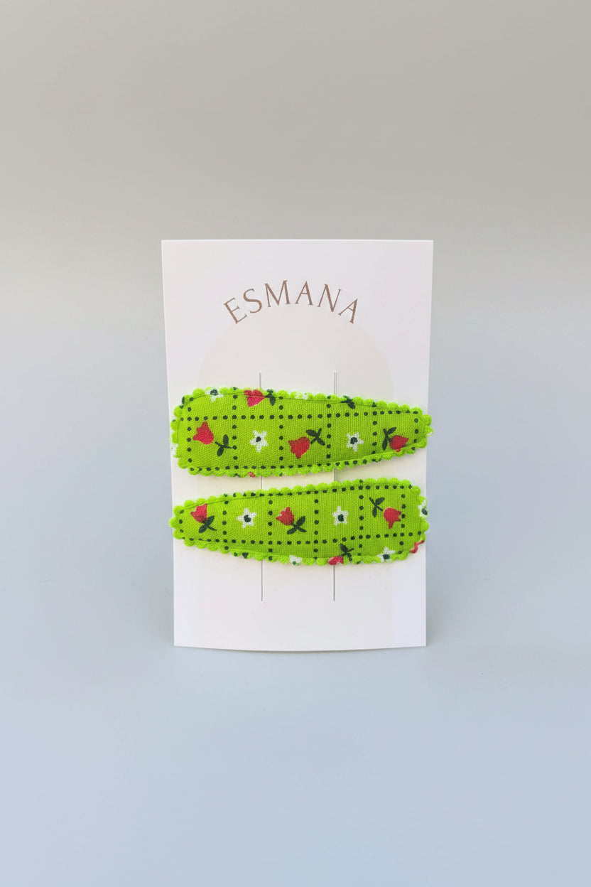 Kind klikspeld groen met kleine bloemetjes