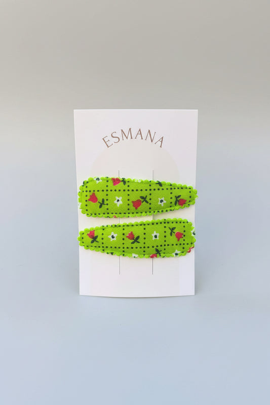 Kind klikspeld groen met kleine bloemetjes