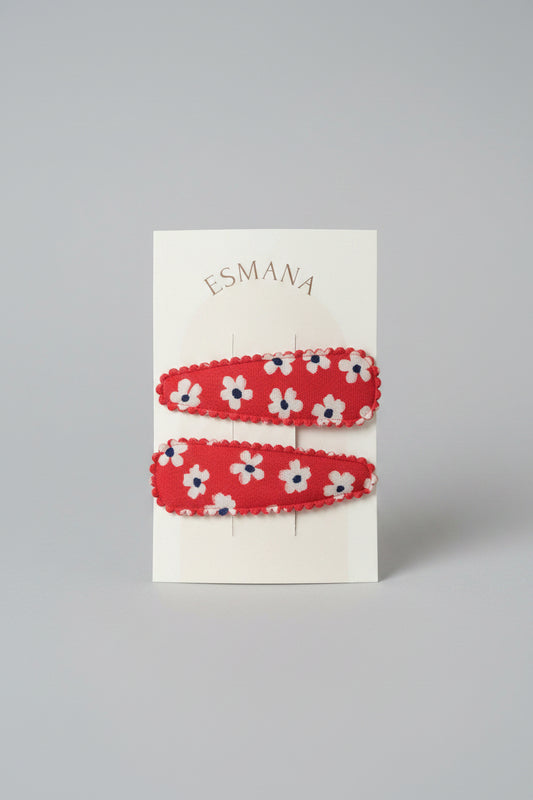 Kind klikspeld rood met witte bloemen