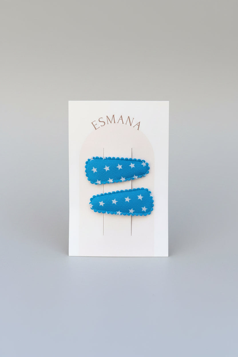 Baby klikspeld blauw met kleine witte sterretjes