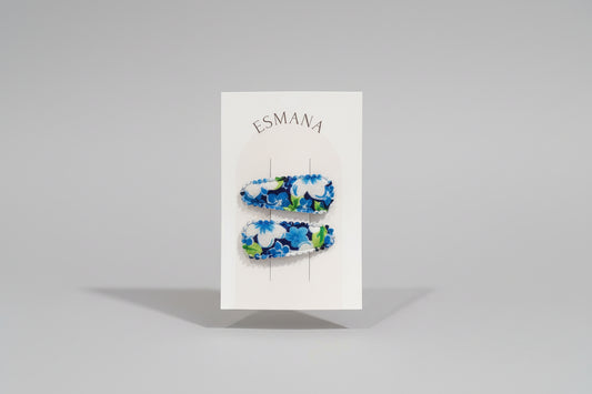 Baby haarspeld met lichtblauwe bloemen