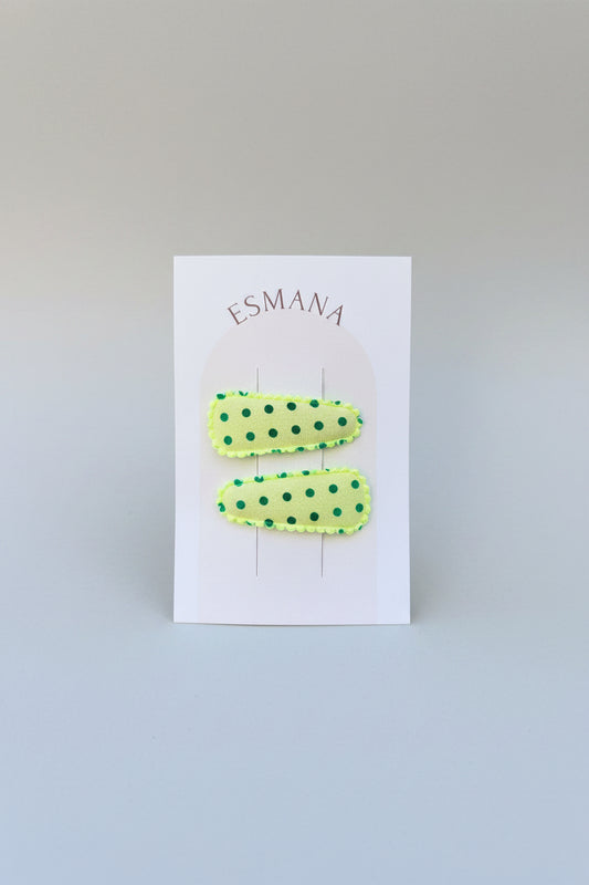 Baby klikspeld lichtgroen met groene stippen