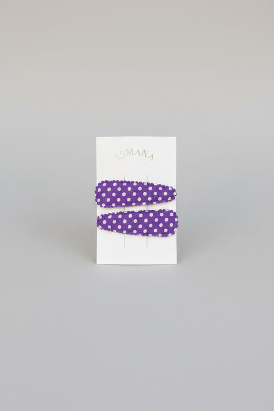 Kind klikspeld paars met witte stippen