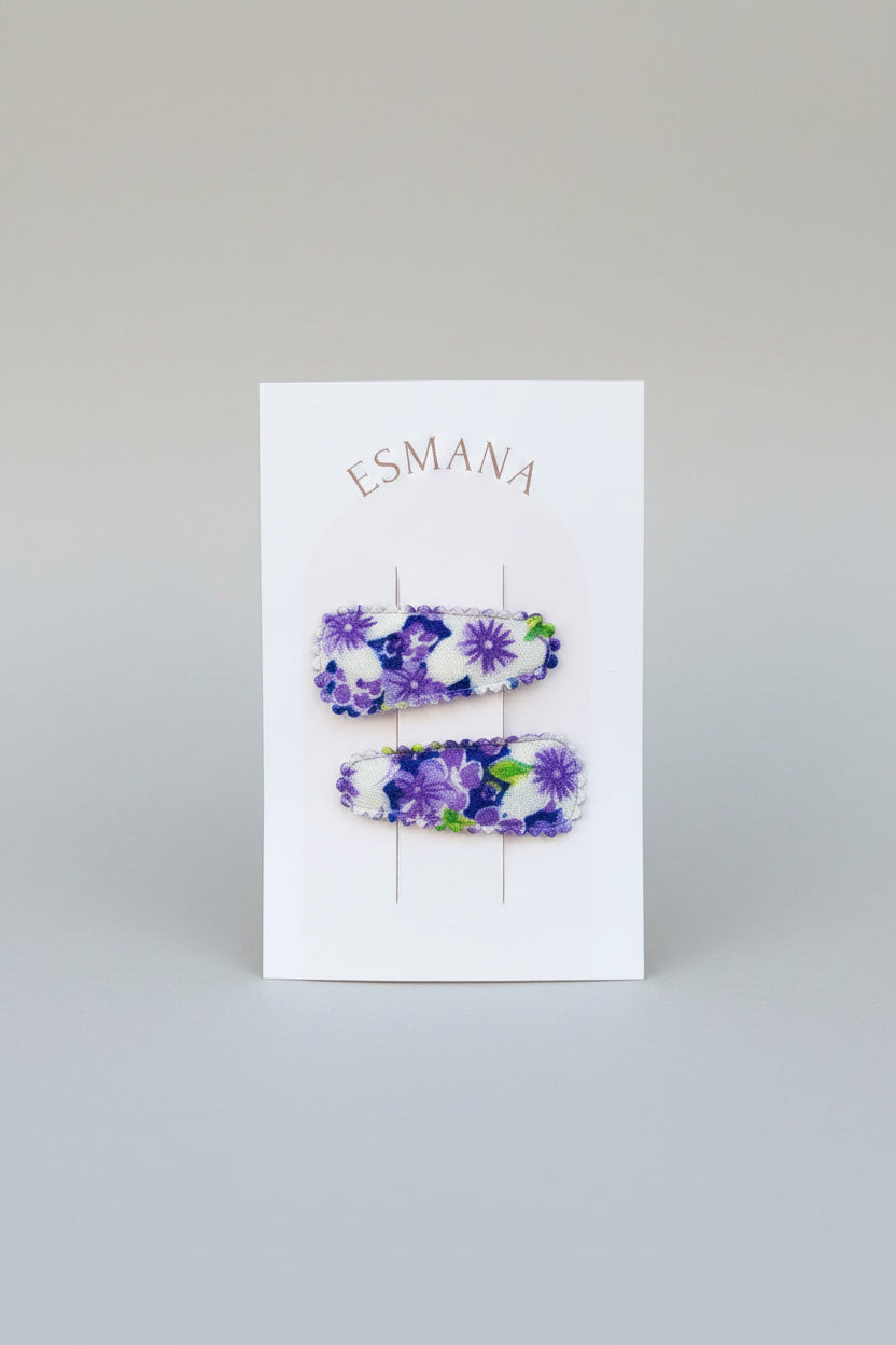 Baby klikspeld met paarse bloemen