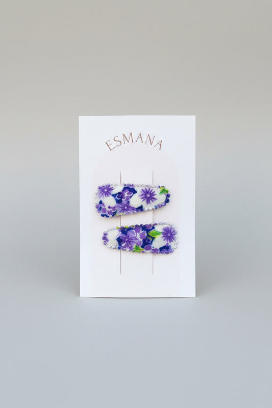 Baby klikspeld met paarse bloemen