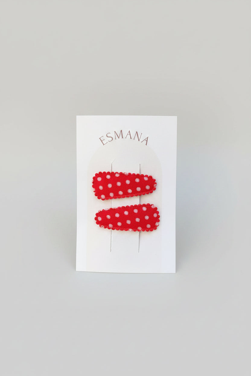 Baby klikspeld rood met witte stippen