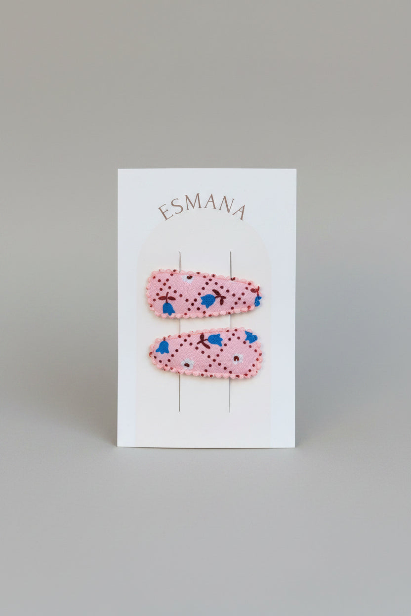 Baby klikspeld roze met kleine bloemetjes