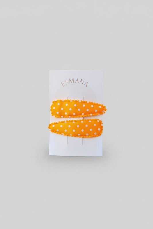 Kind klikspeld satijn oranje met witte stippen